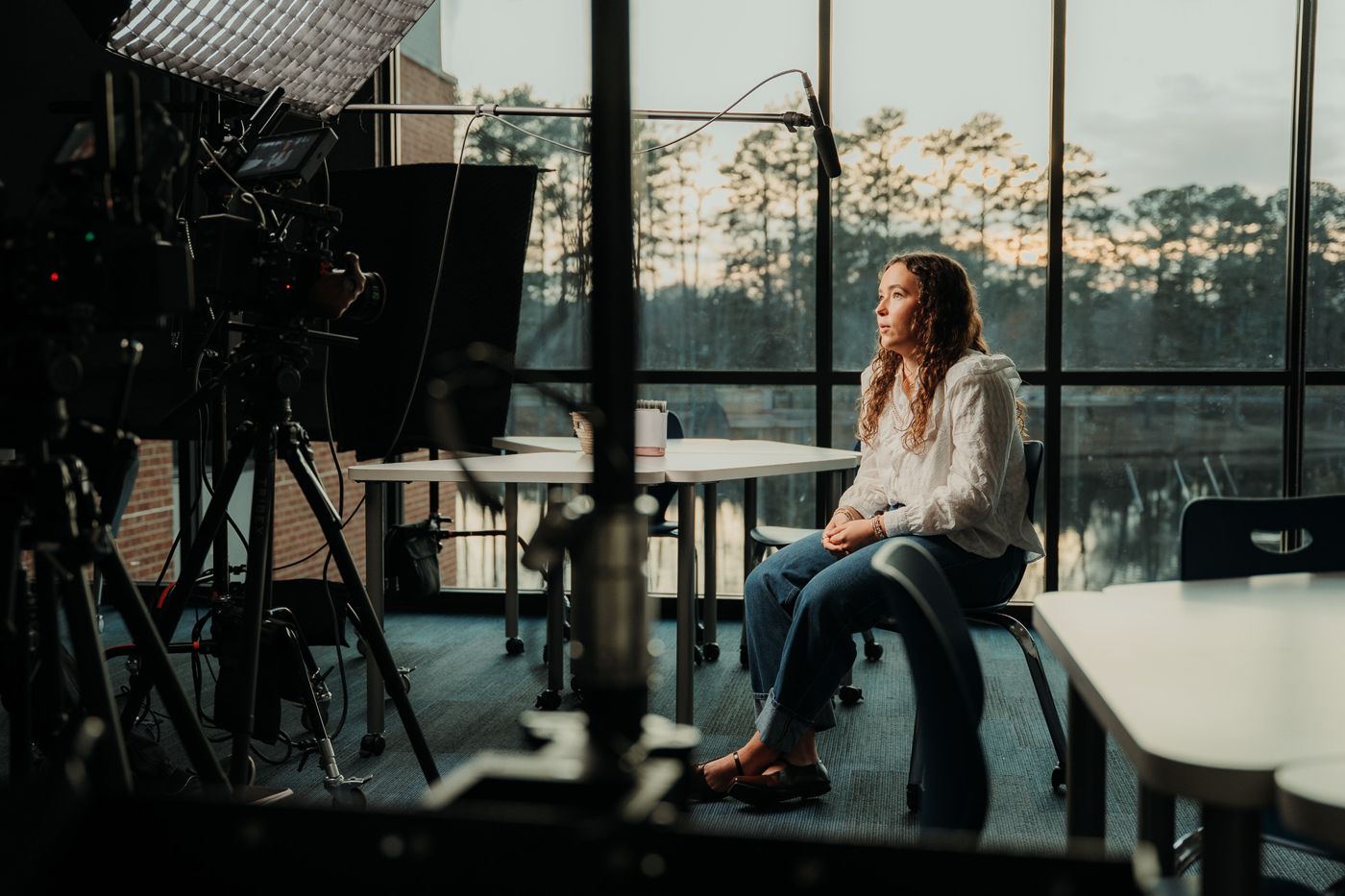 An interview set facing a lake at golden hour