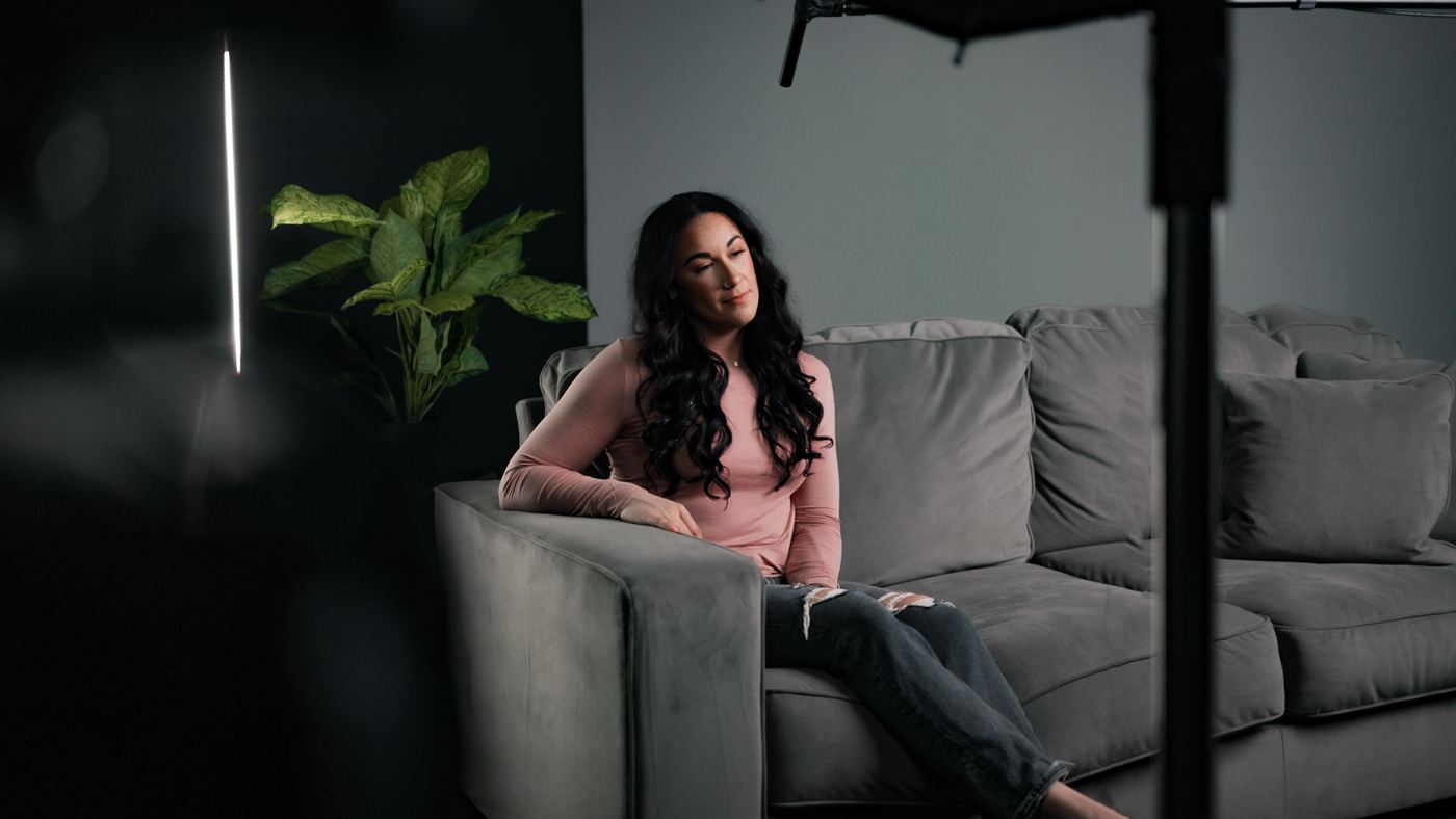 An interview on a grey sofa