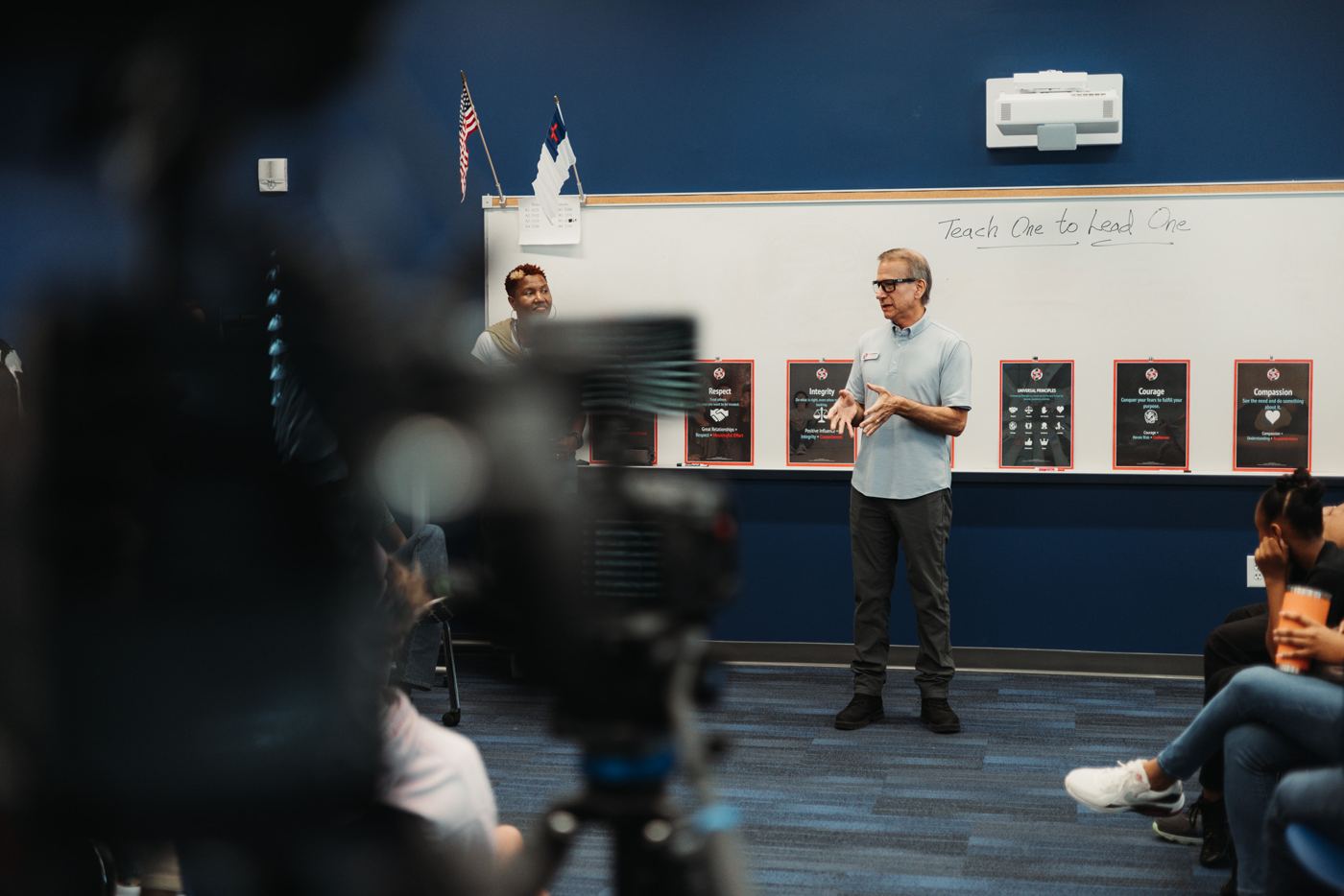 Filming a leadership talk in a classroom
