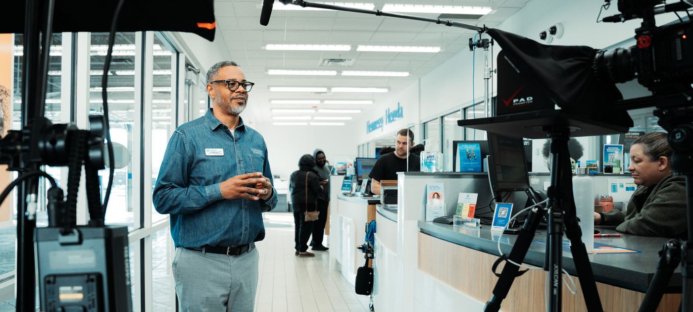 A multi-camera interview on a dealership floor