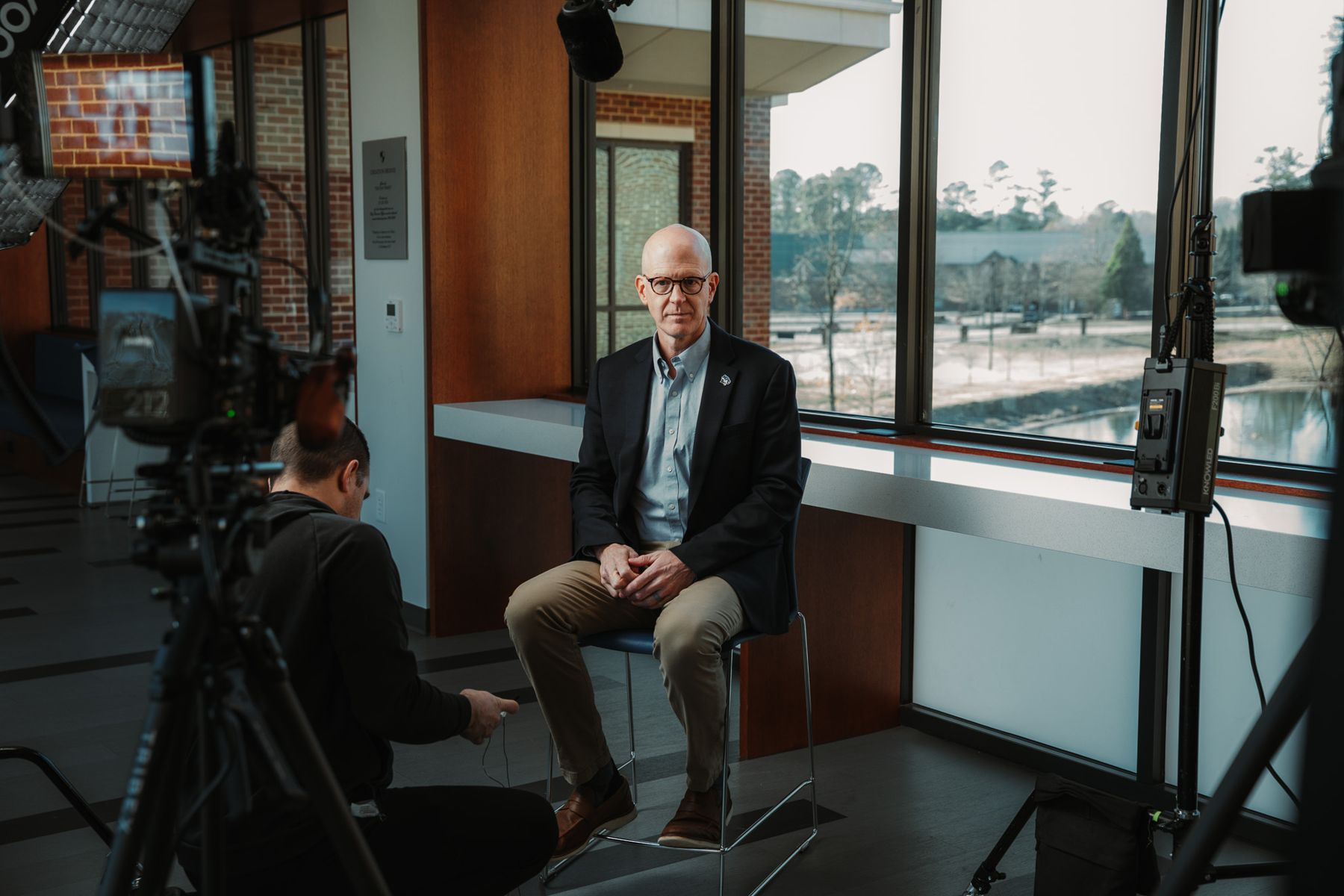 An executive interview by a window