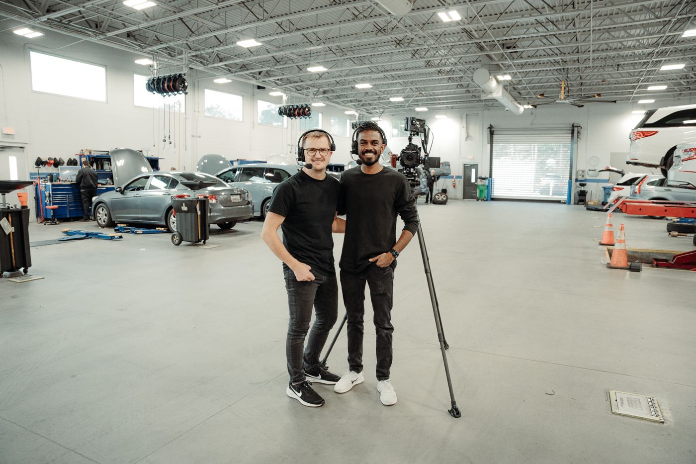 Two crew members on a dealership shoot