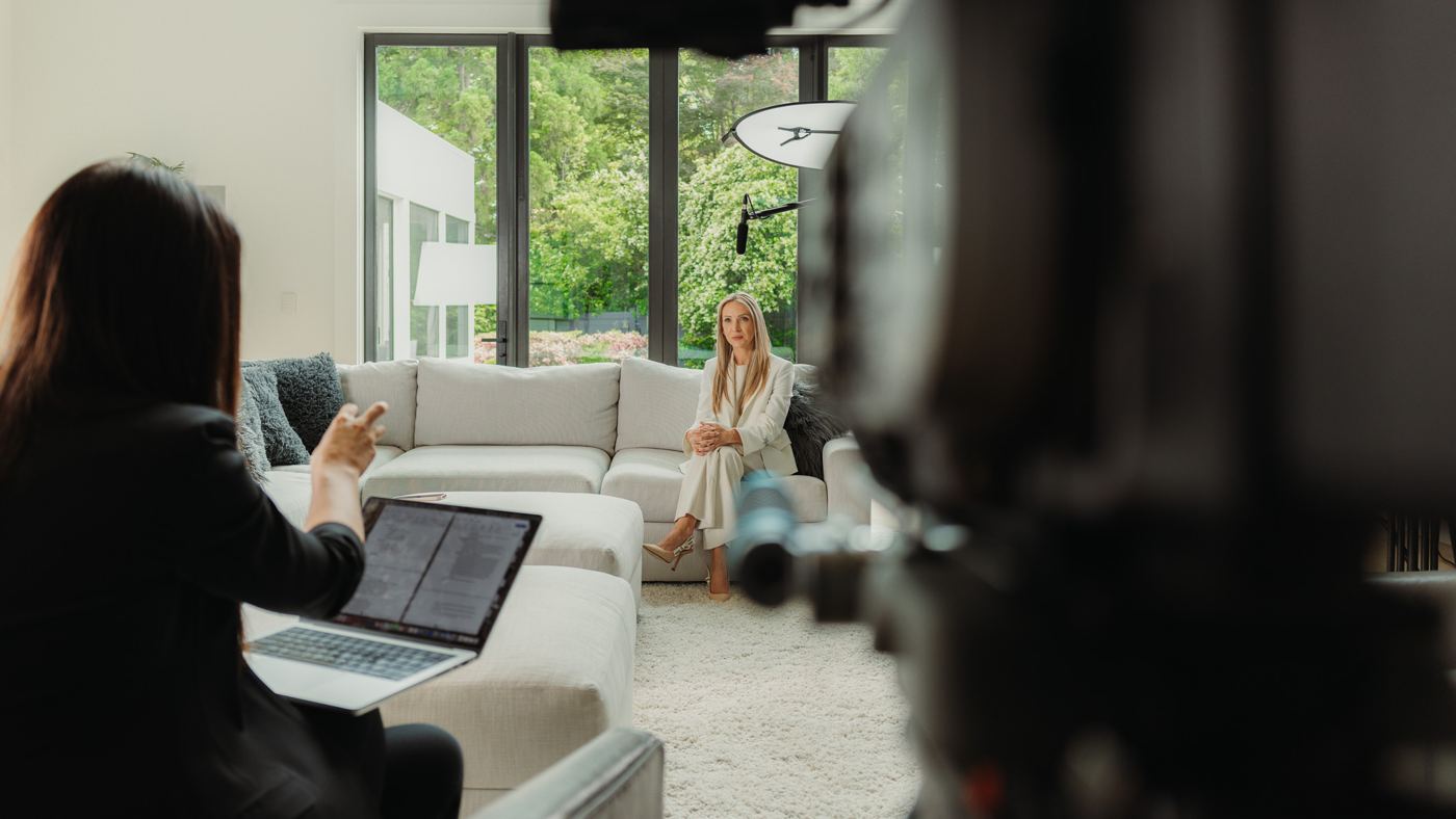 A producer running an interview from her laptop