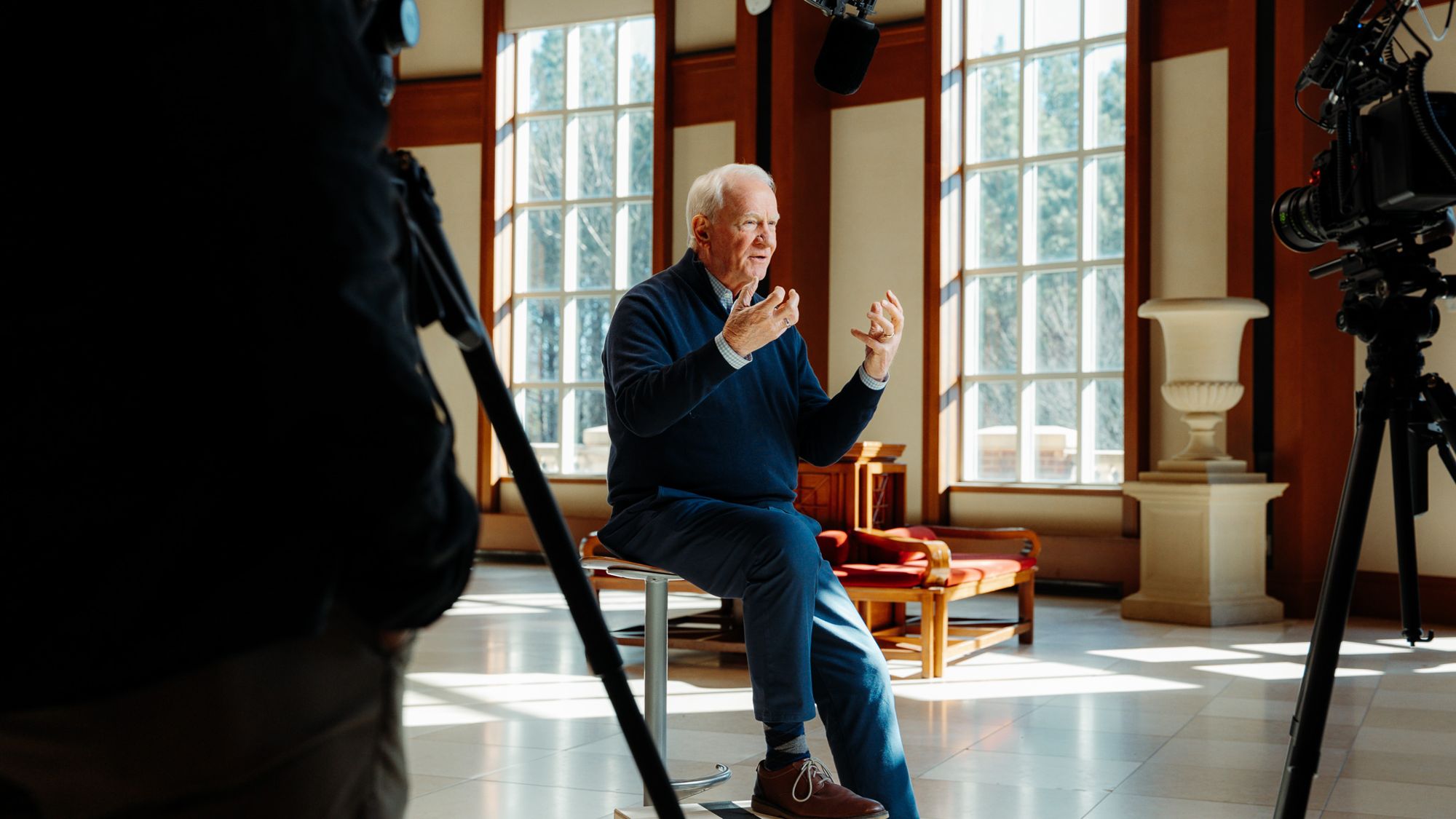 Filming an interview in a sunlit hall for Mount Paran's 50th anniversary film